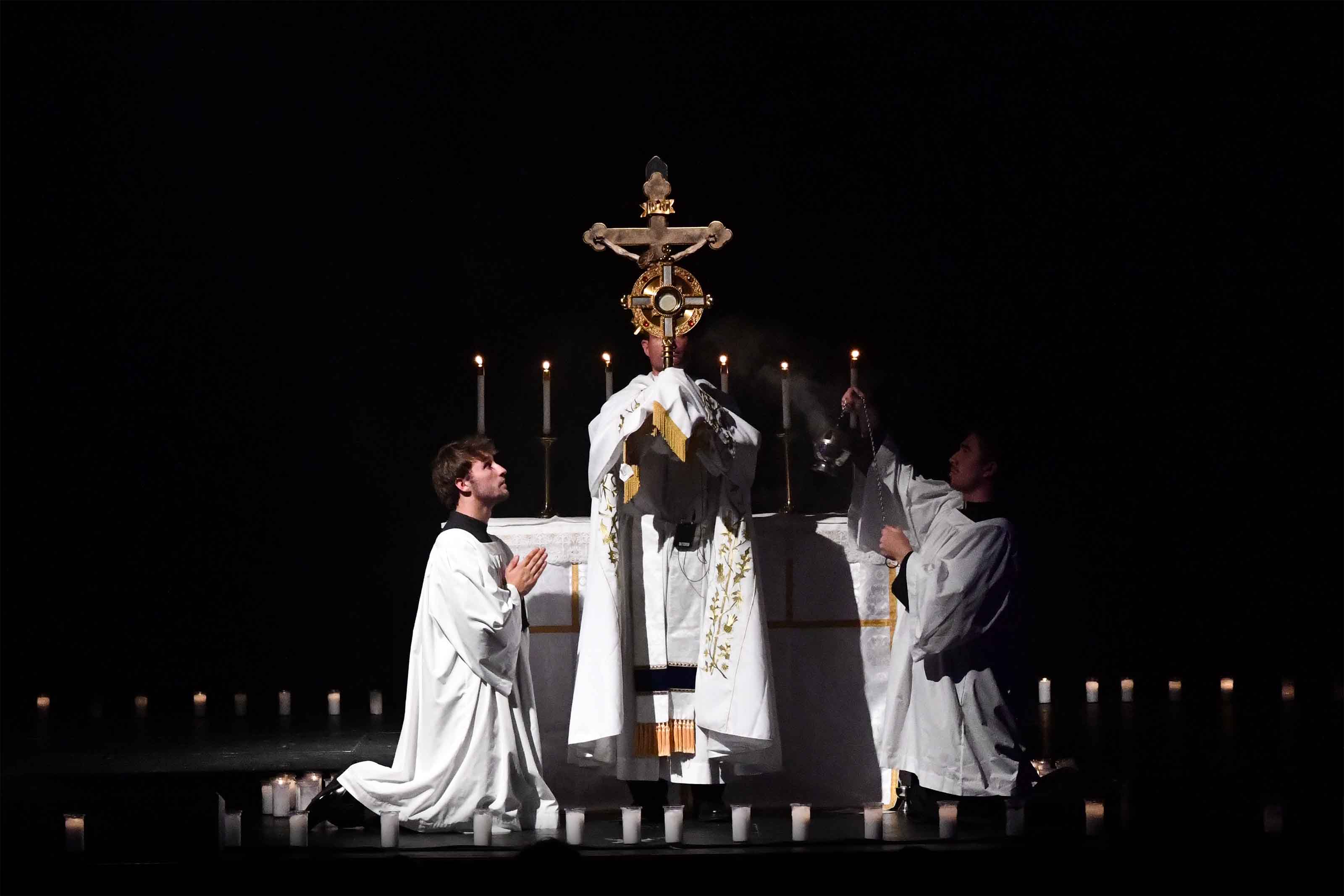 A priest elevates the monstrance during Eucharistic adoration