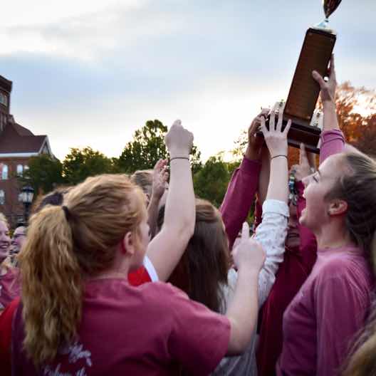 Students celebrate victory at the Homecoming Bed Races