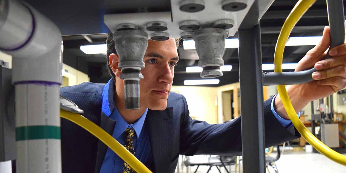 A student examines lab equipment