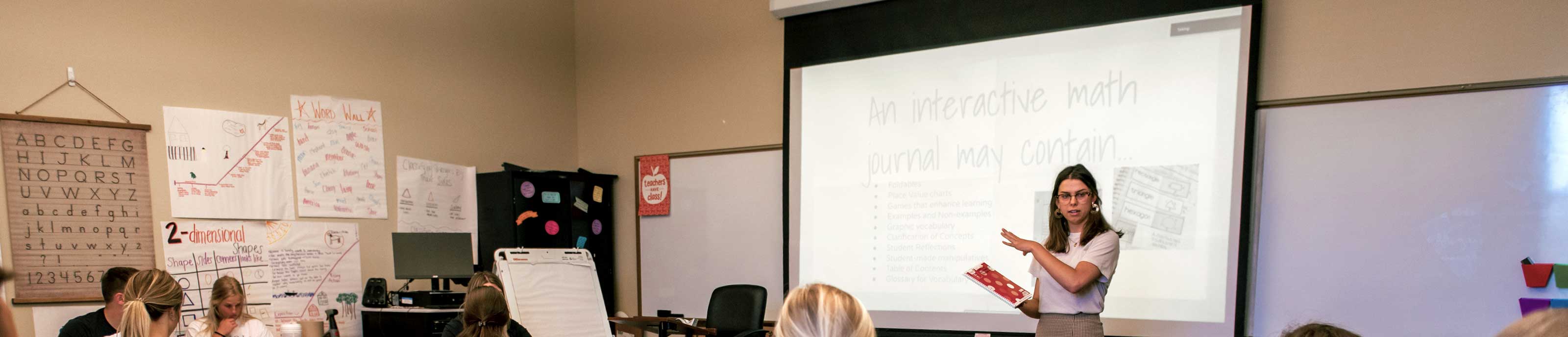 Benedictine College student giving a presentation in the education department