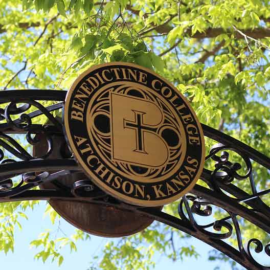 The Benedictine College Seal on the peak of an arch