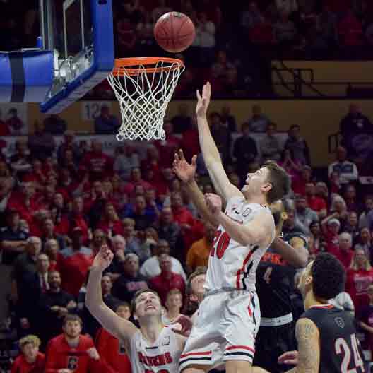 A Benedictine College Men's Basketball player makes a basket