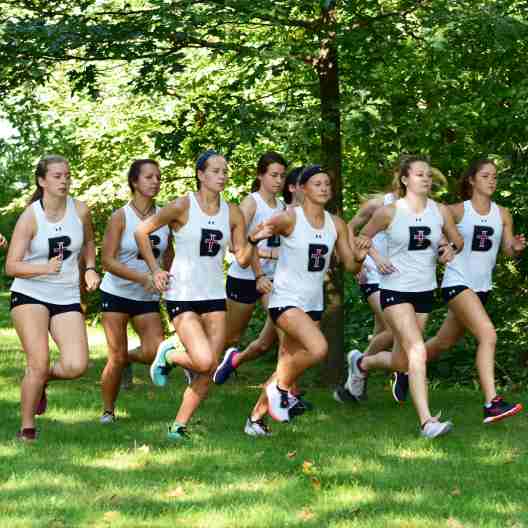 Lady Ravens cross country team running in a pack