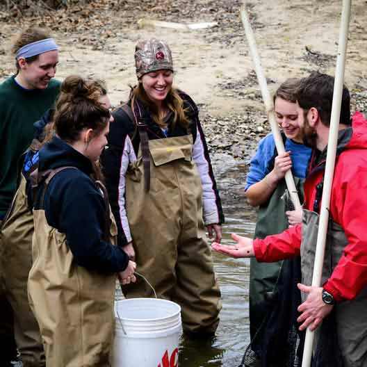 Students outdoors in Dr. Terrence Malloy's Biology Class