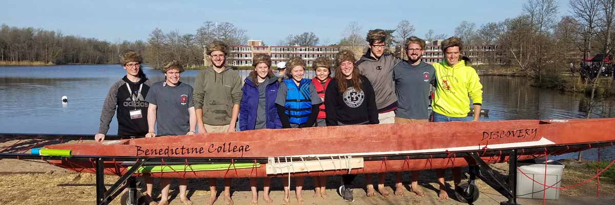 Benedictine College ASCE Student Chapter in front of a conrete canoe