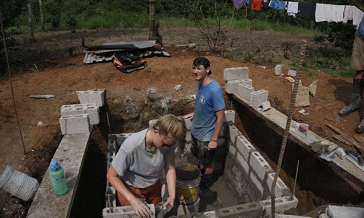 Students working on a foundation during a mission trip