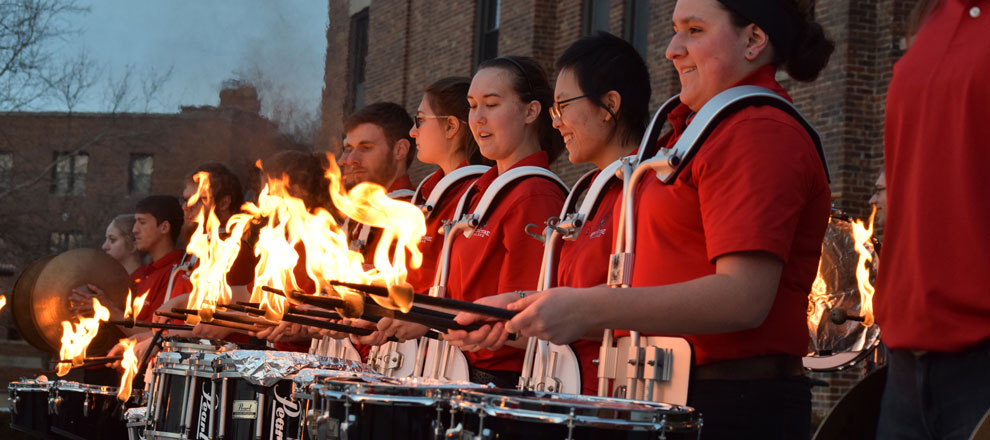 Drum Corps marching during the Homecoming 2016 parade