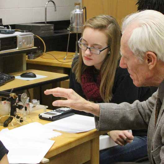 Dr. Doug Brothers assists a student in lab