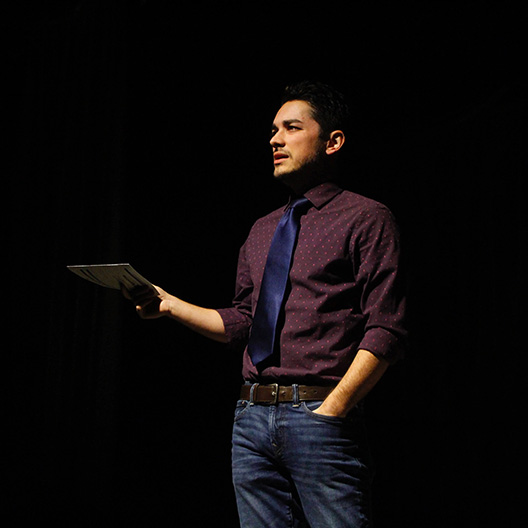 Faculty Dr. Nathan Bowman teaching on stage
