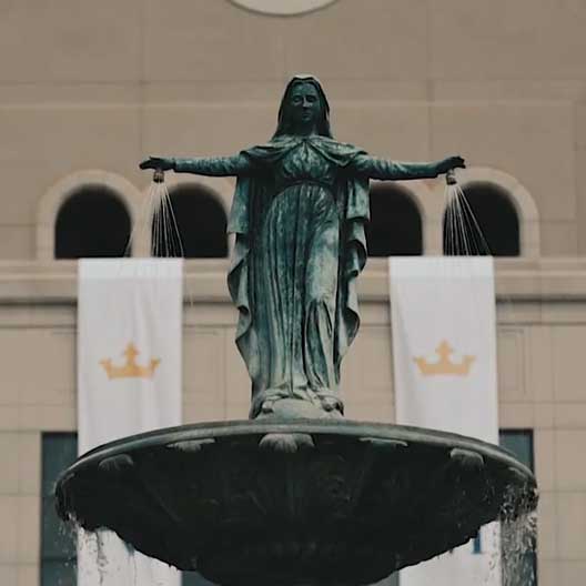 The statue of Mary atop Our Lady of Grace Fountain