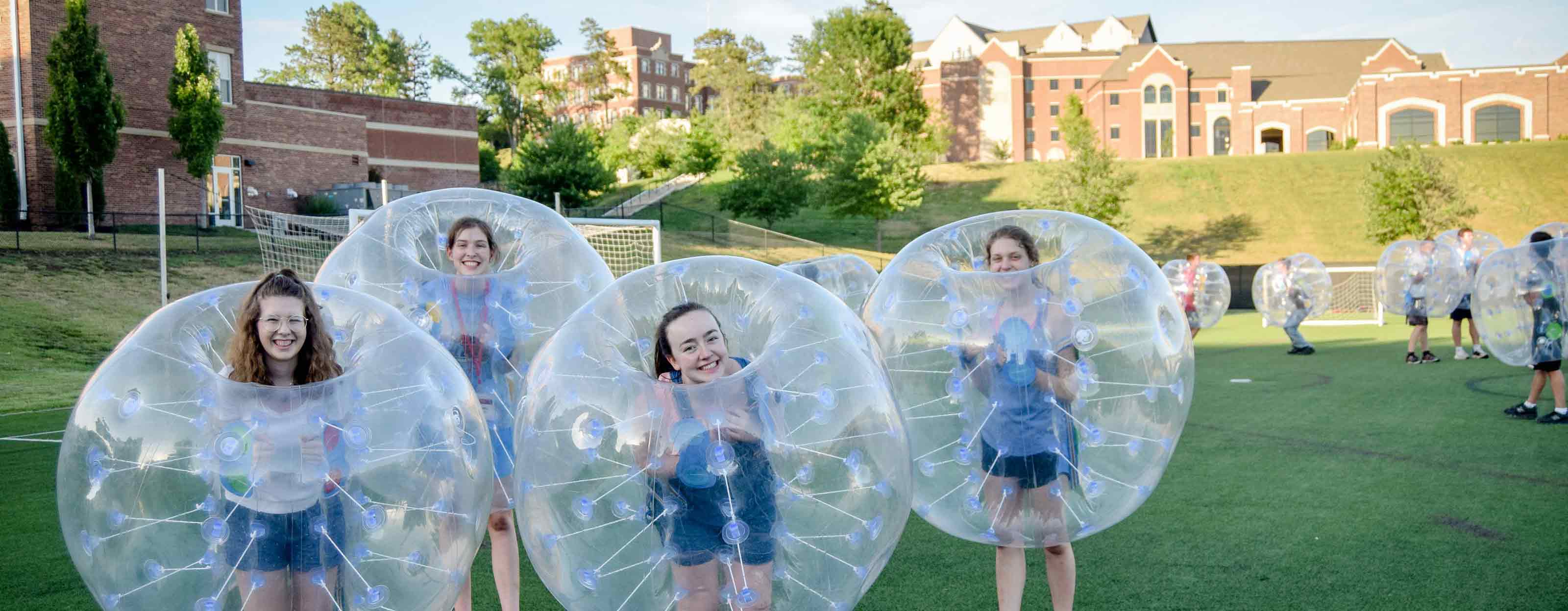 Students playing bubble soccer at BCYC Immersion