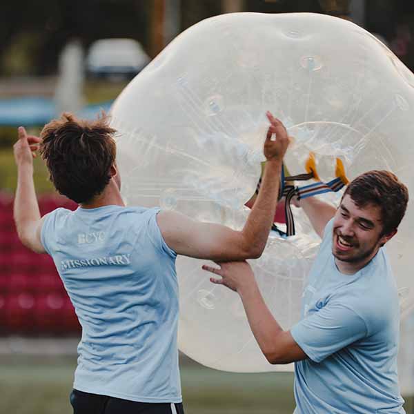 BCYC close up of two students in a game with inflatable bubble-soccer ball 