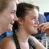 Two computer science students smiling 