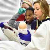 BCYC Immersion participants learn how to care for a woman in labor and for her newborn child