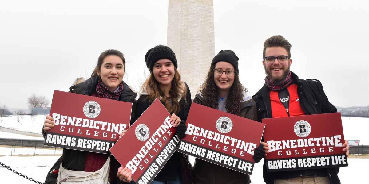 Pro-life students hold signs in front of the Washington Monument