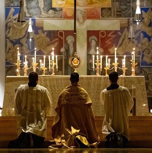 BCYC Encounter adoration priest and two altarboys kneeling