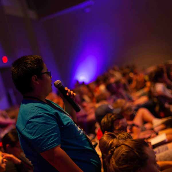 A BCYC Encounter participant asks a question during a speaker presentation