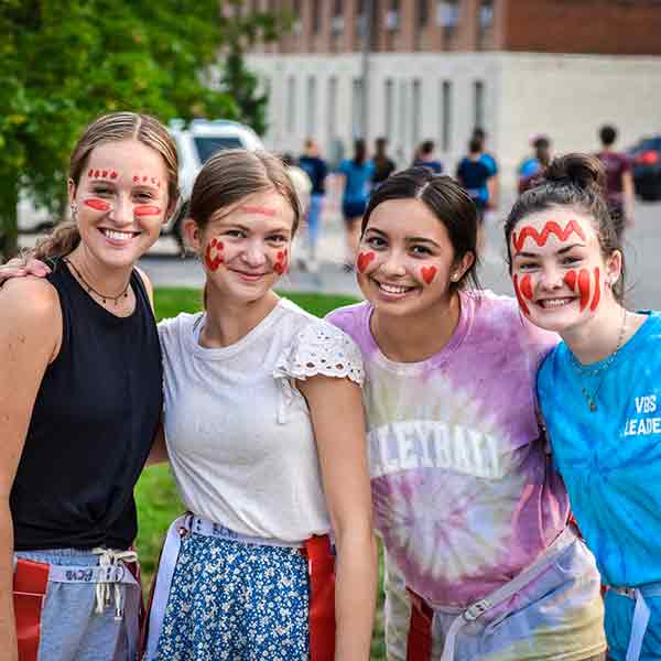 BCYC participants pose with face paint during Capture the Flag