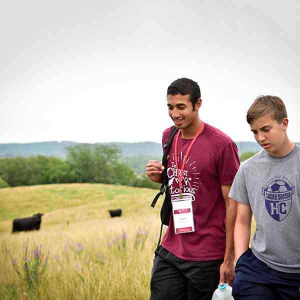 BCYC participants hiking with cows in the background