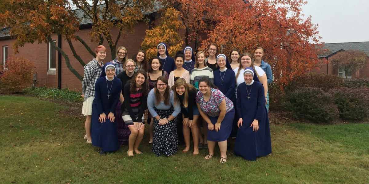 Students posing with the CK Sisters