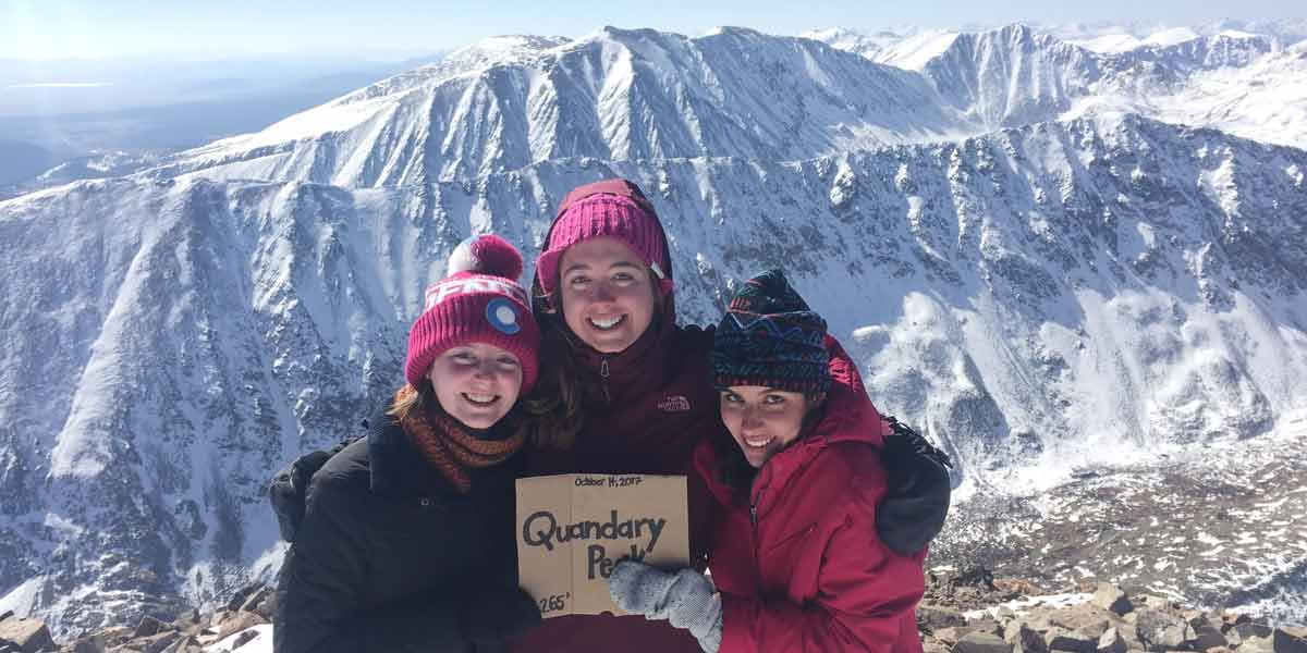 Students on top of a snowy Quandary Peak