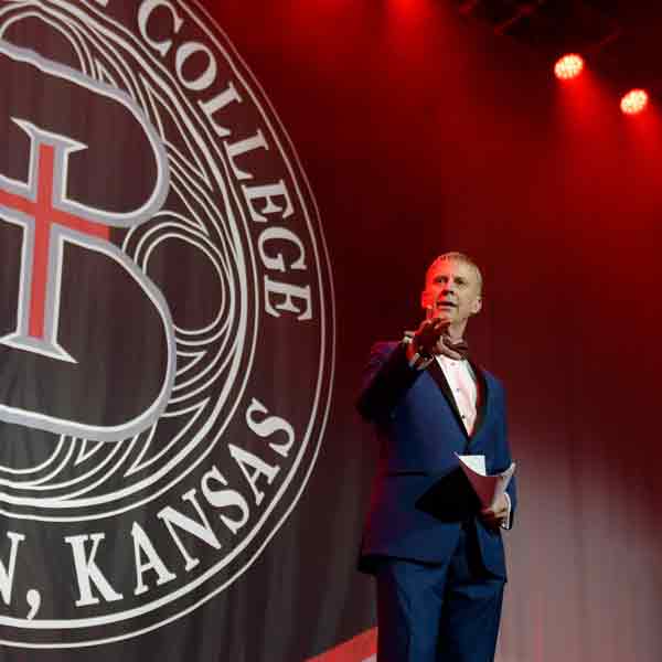 Scholarship Ball emcee John Holt on stage