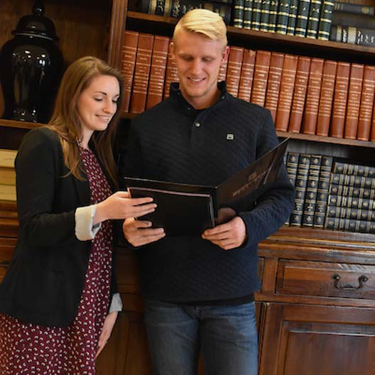 Students smiling while reading