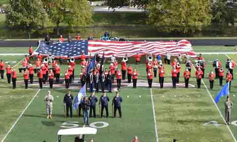 The American Flag presented on the football field on Stars and Stripes Day