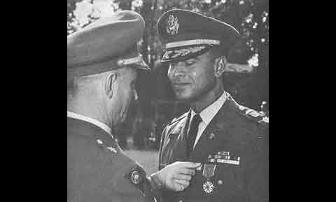 Photo from the 1967 Raven Review showing then Lt. Col. Gregg receiving the Legion of Merit