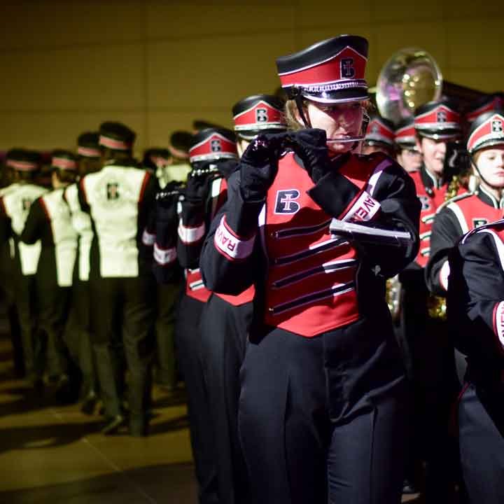 Flute section of the Raven Regiment marching band in uniform