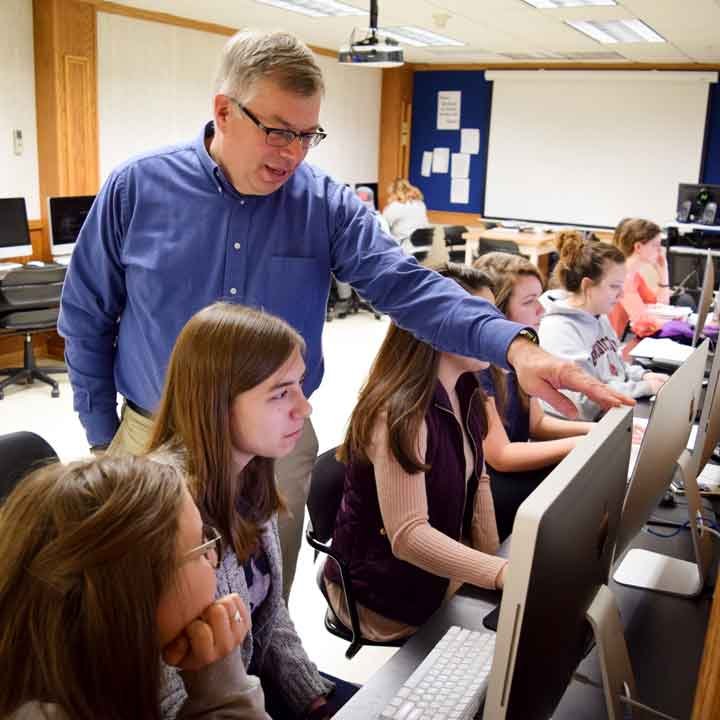 Students in a computer lab with Dr. Kevin Page