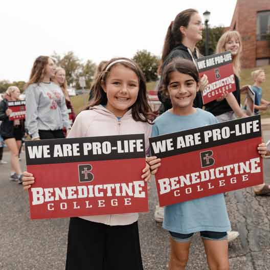 Two children hold Pro-Life signs during a march