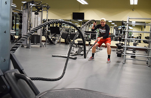 Student exercising with rope