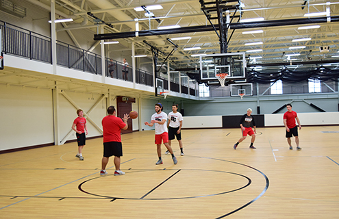 Playing basketball in the rec-center gym