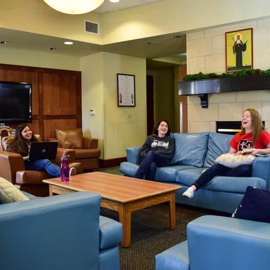 Students hanging out in St. Scholastica Hall