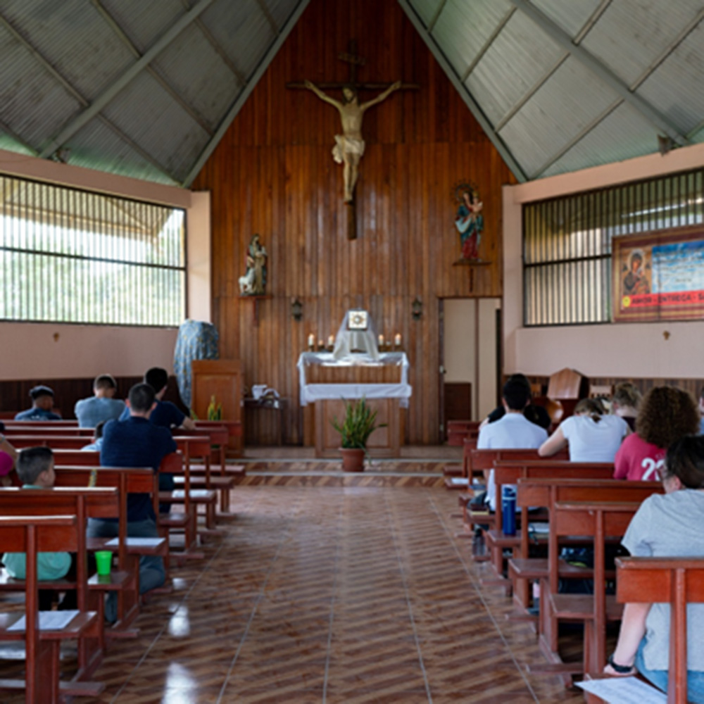 People praying in a church in Peru