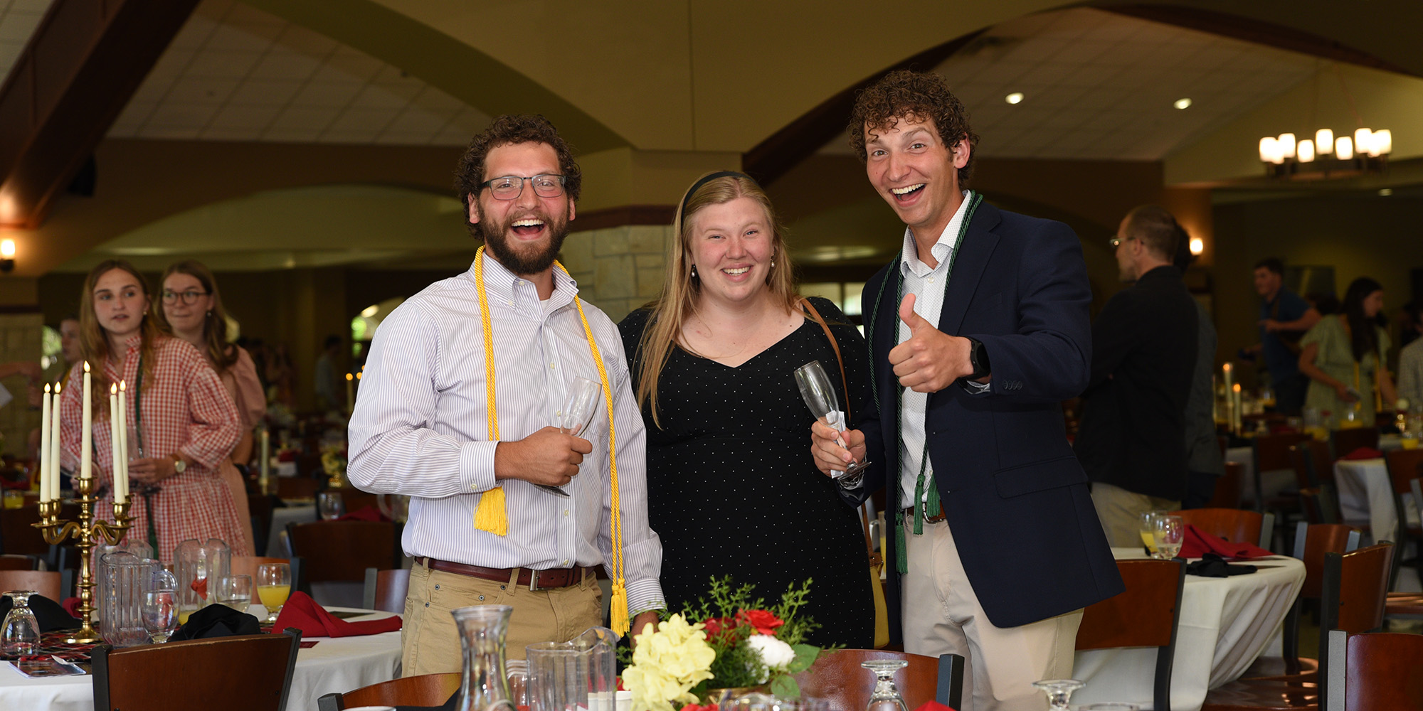Graduates pose at the Champagne Brunch