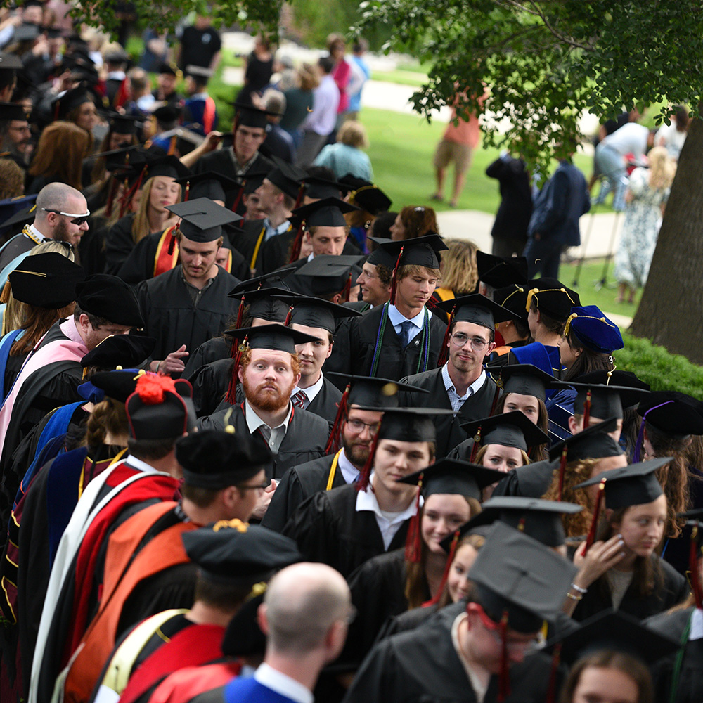 Graduates process up the Raven Walk during the March of Light