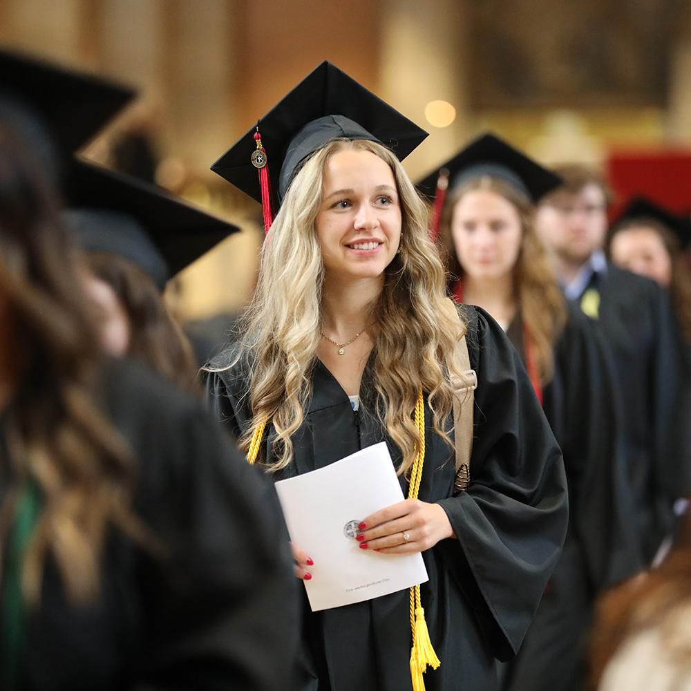 Graduates process out of the Baccalaureate Mass