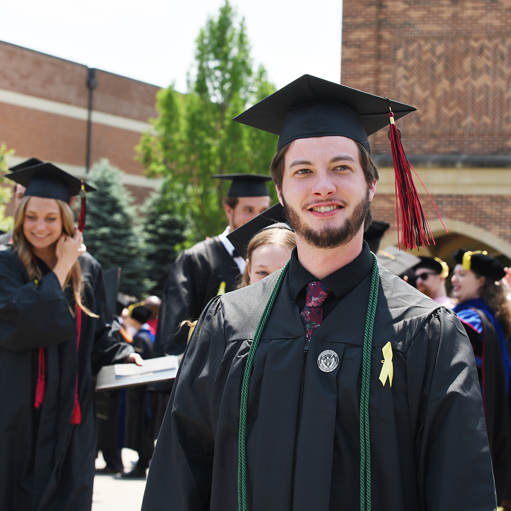 Graduates celebrating after Commencement