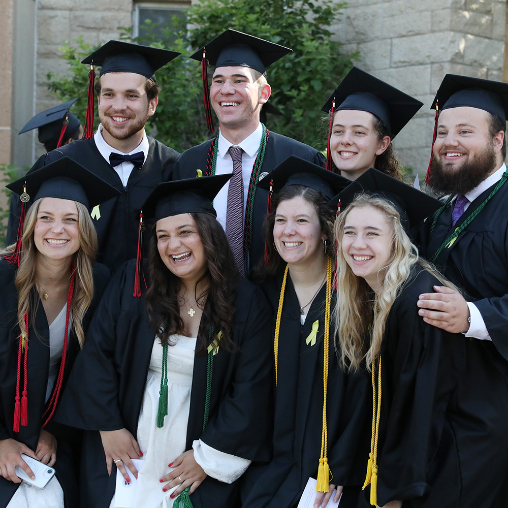 Graduates pose for a photo before Commencement