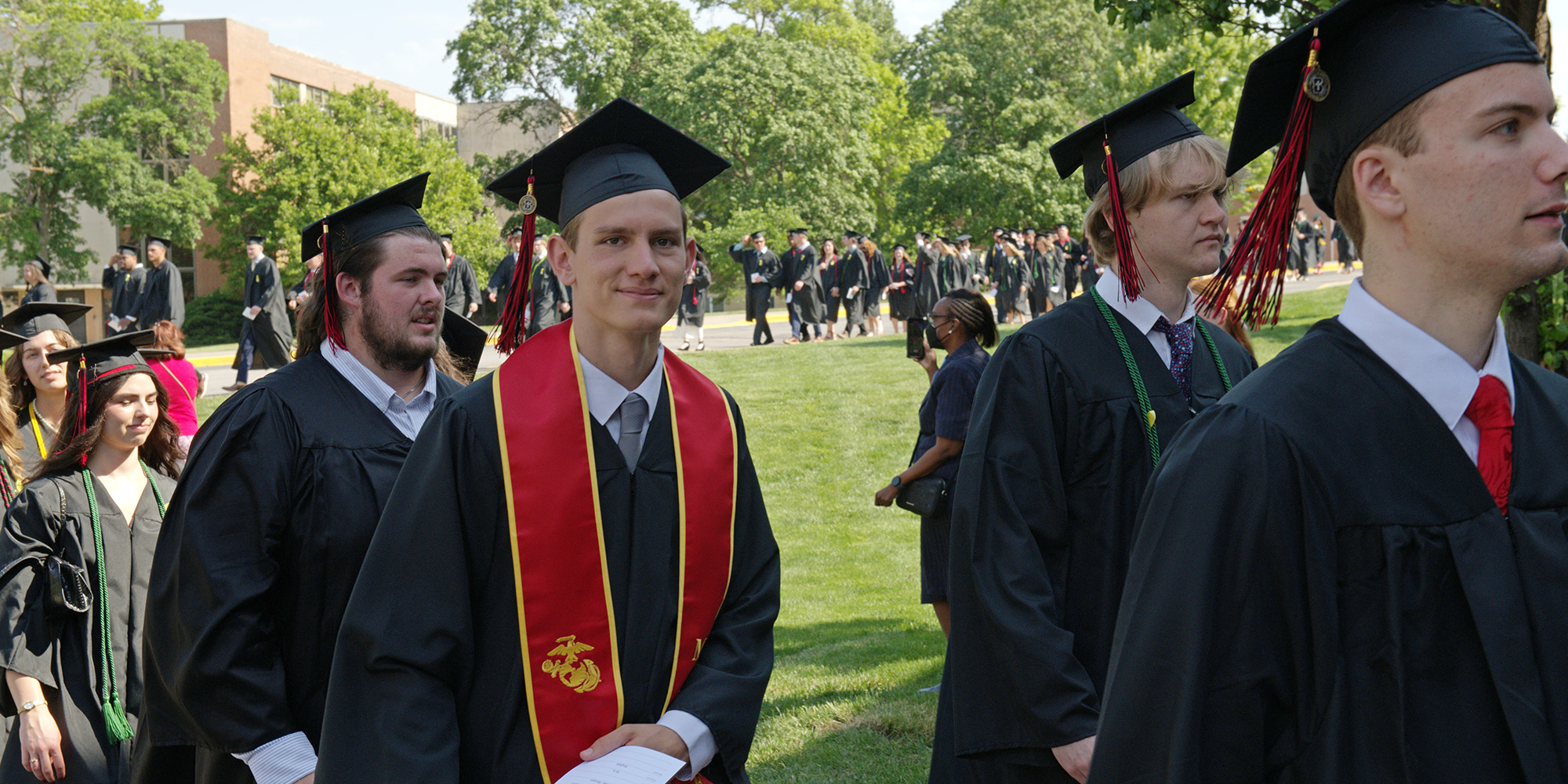 Graduates process into the Commencement ceremony