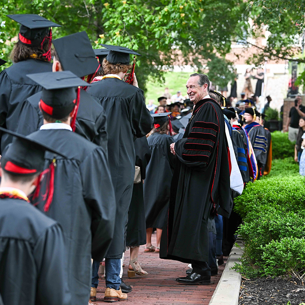 President Minnis greets graduates during the March of Light