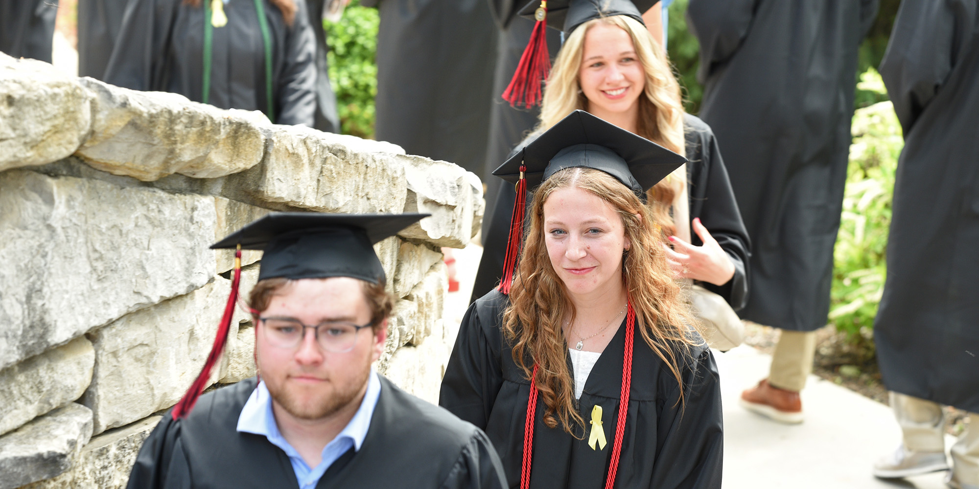 Graduates at Mary's Grotto during the March of Light