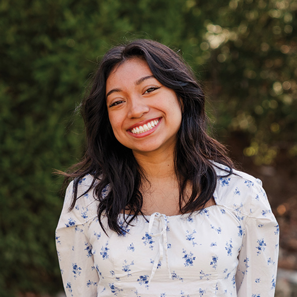 A student poses for a photo