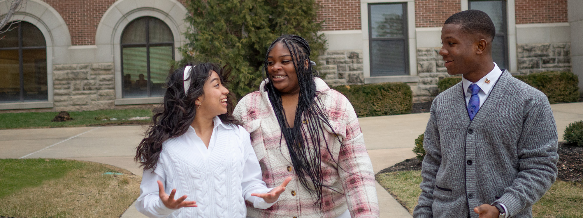 Students walking and talking on campus
