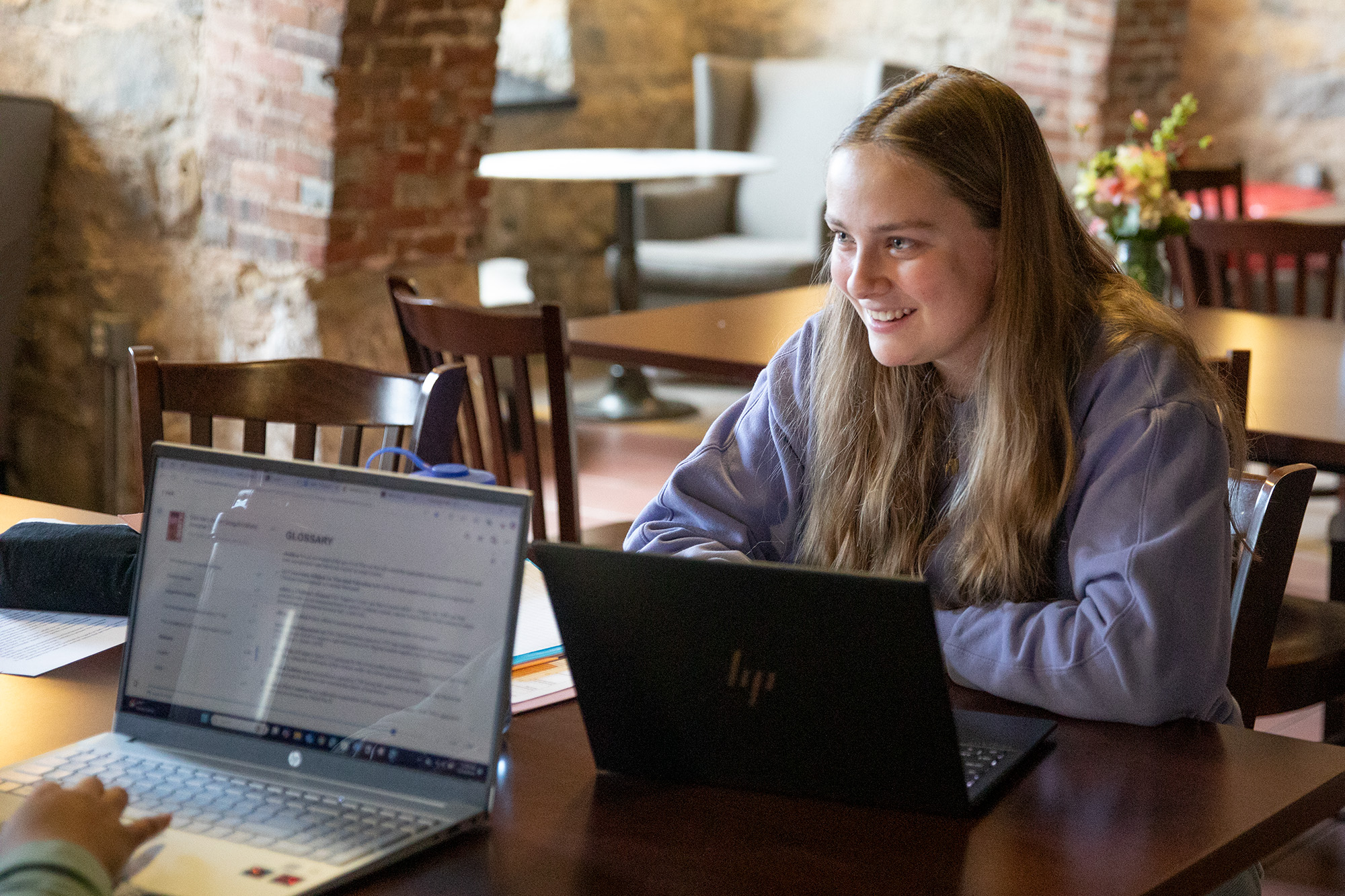 A student works on her laptop