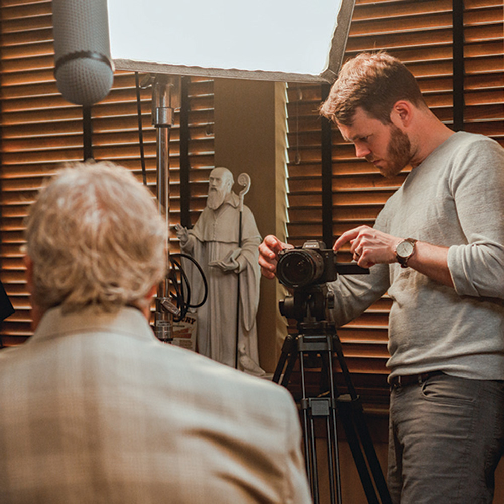A videographer works during a shoot