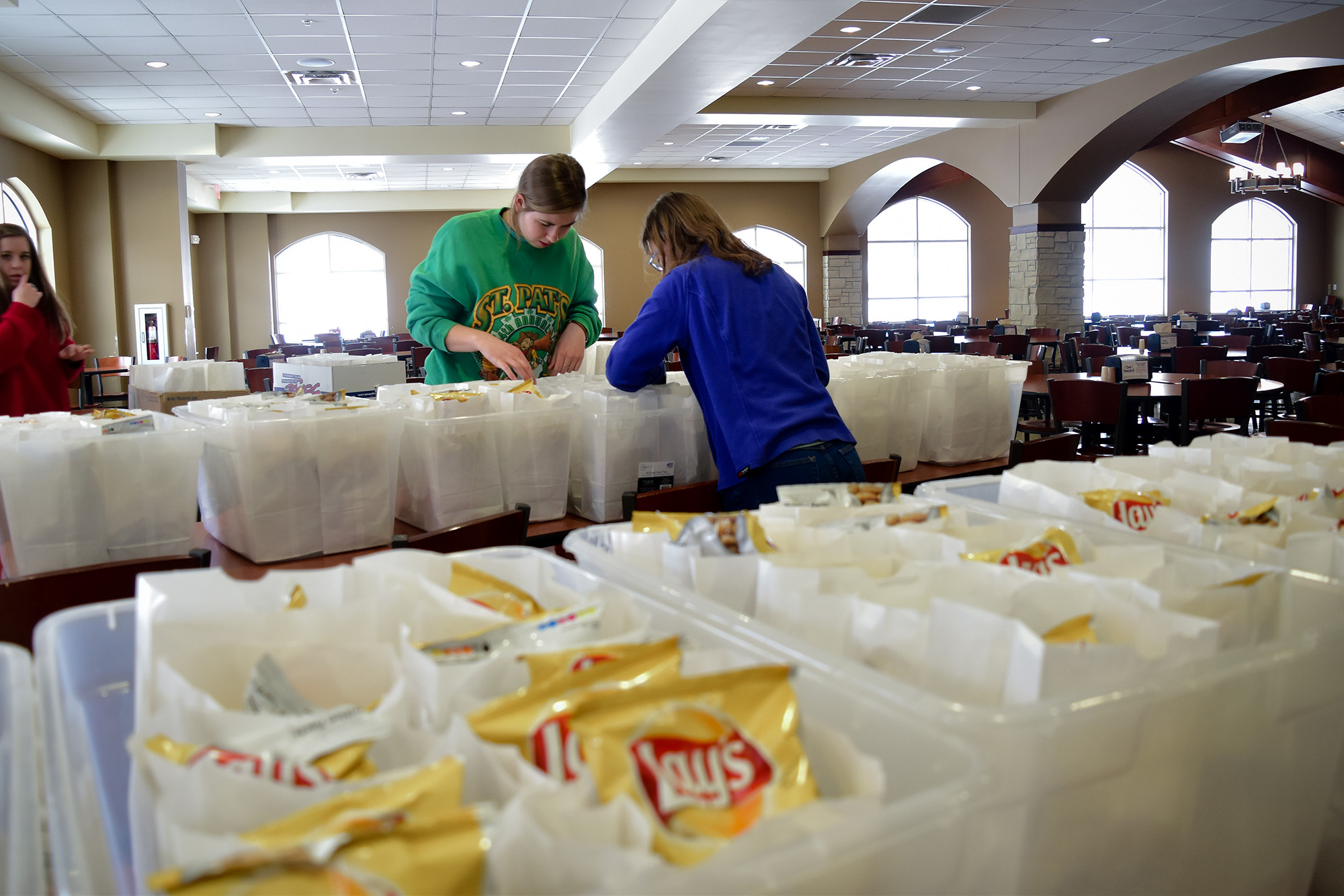 Students prepare sack lunches for the Hunger Coalition