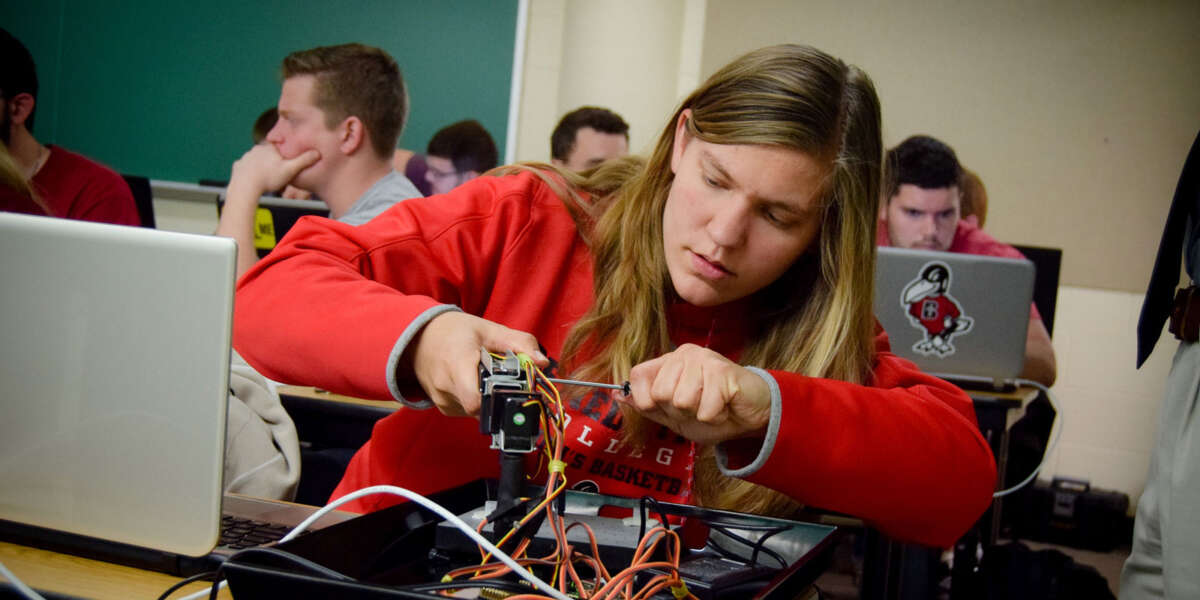 A student works on a project in electrical engineering class